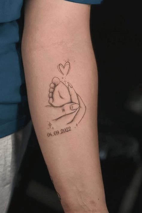 Baby Foot In Hand Tattoo For Mom And Dad Tattoo Design