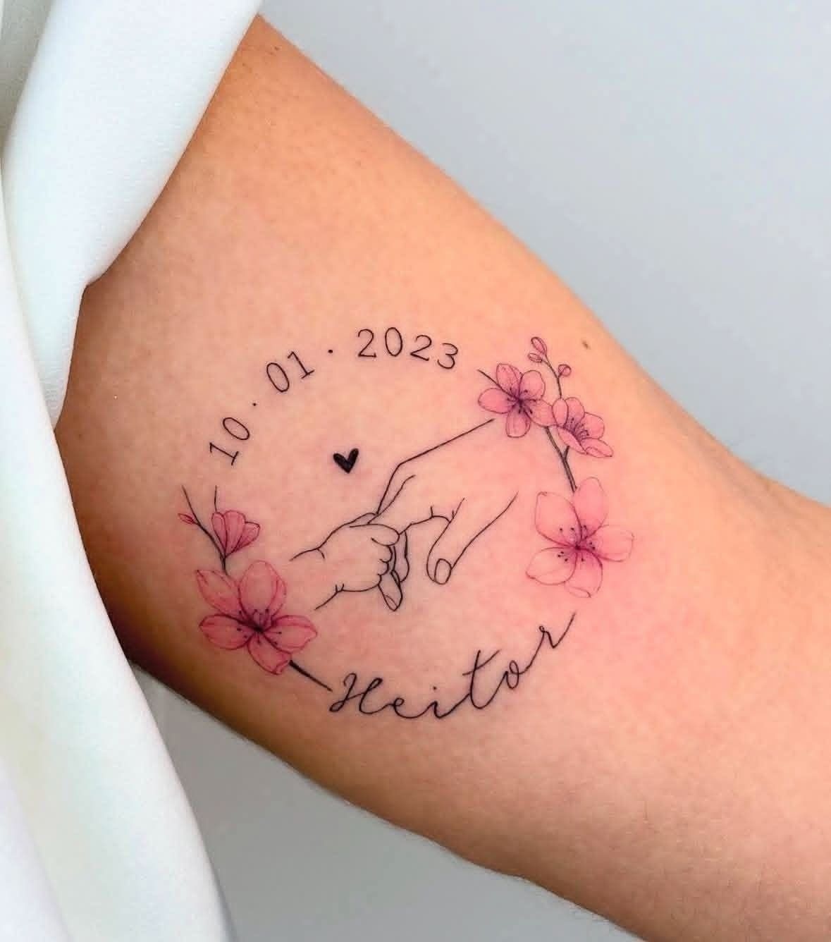 Floral Circle Baby Hand Holding Tattoo Tattoo Design