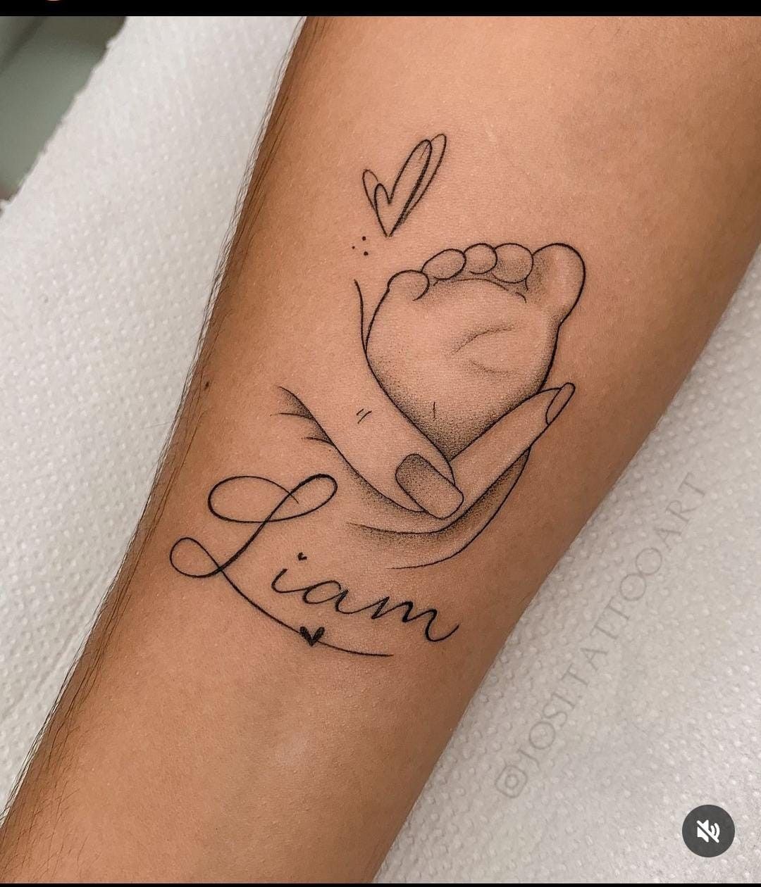 Gentle Baby Foot-in-Hand Tattoo With Flowing Name Tattoo Design
