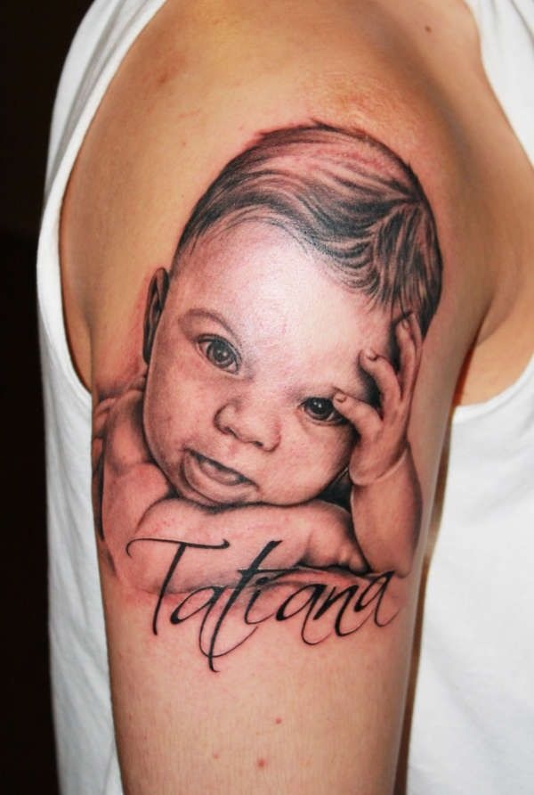 Gentle Baby Portrait Tattoo With Flowing Script Tattoo Design