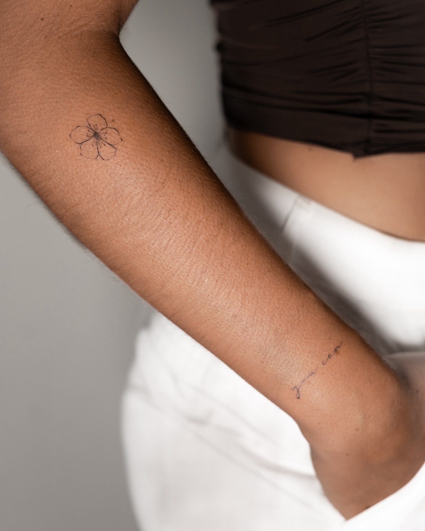 Minimal Flower and Script Arm Tattoo Tattoo Design