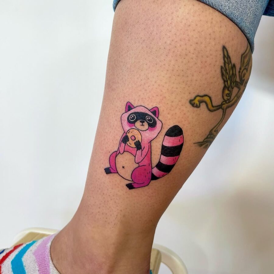 Adorable raccoon holding a bagel tattoo Tattoo Design
