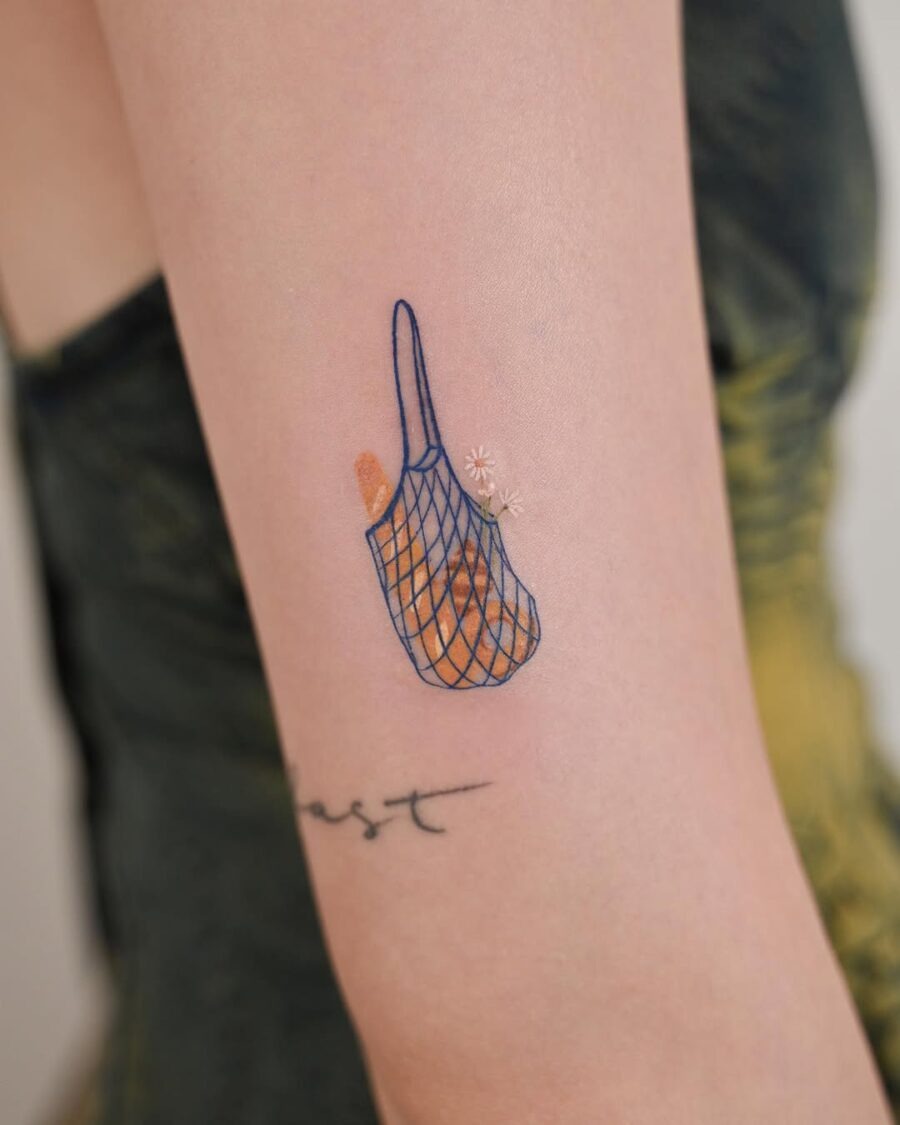 Charming bagel net tattoo on the arm Tattoo Design