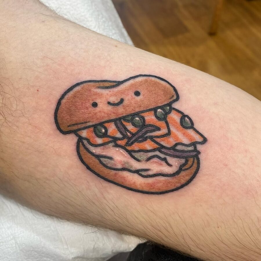 Charming bagel tattoo with playful elements Tattoo Design