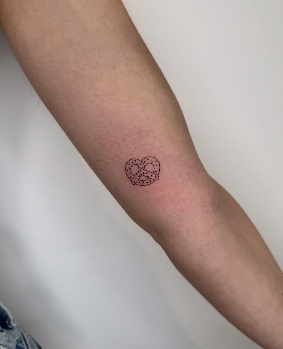 Charming pretzel heart tattoo on forearm Tattoo Design