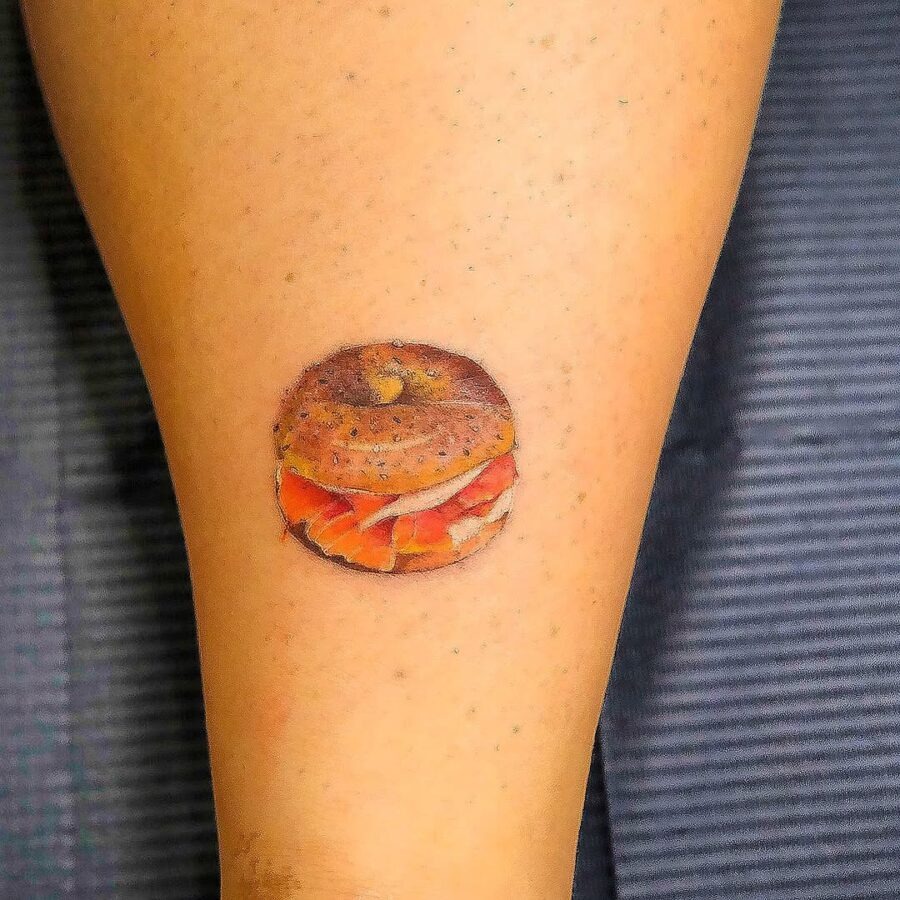 Deliciously detailed leg bagel tattoo design Tattoo Design