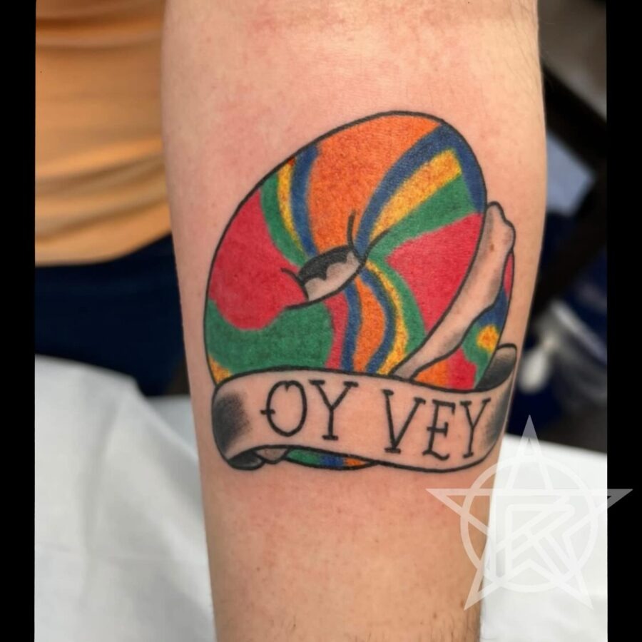 Playful bagel tattoo with vibrant colors Tattoo Design