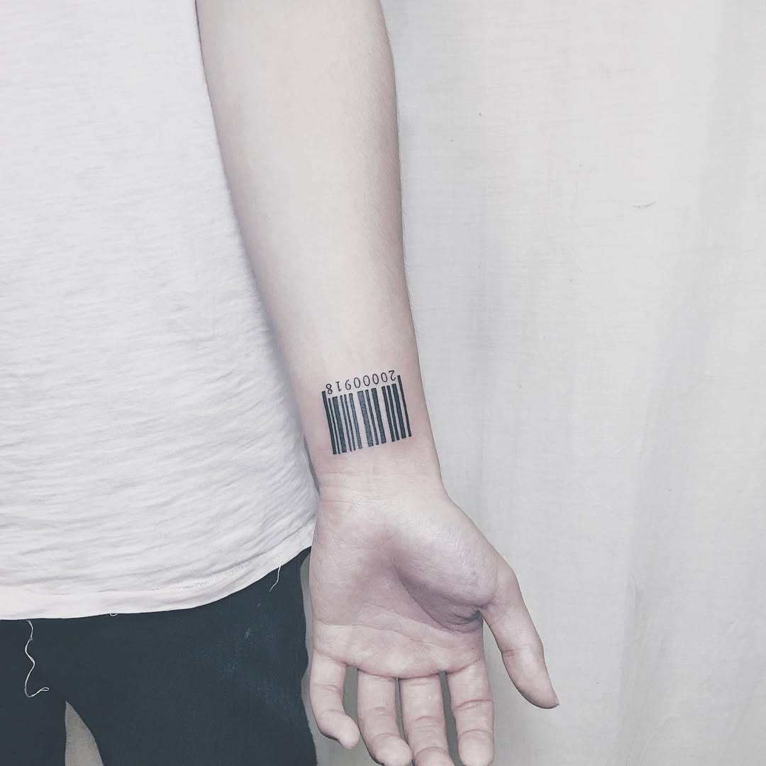 This striking barcode tattoo makes a statement on the arm.