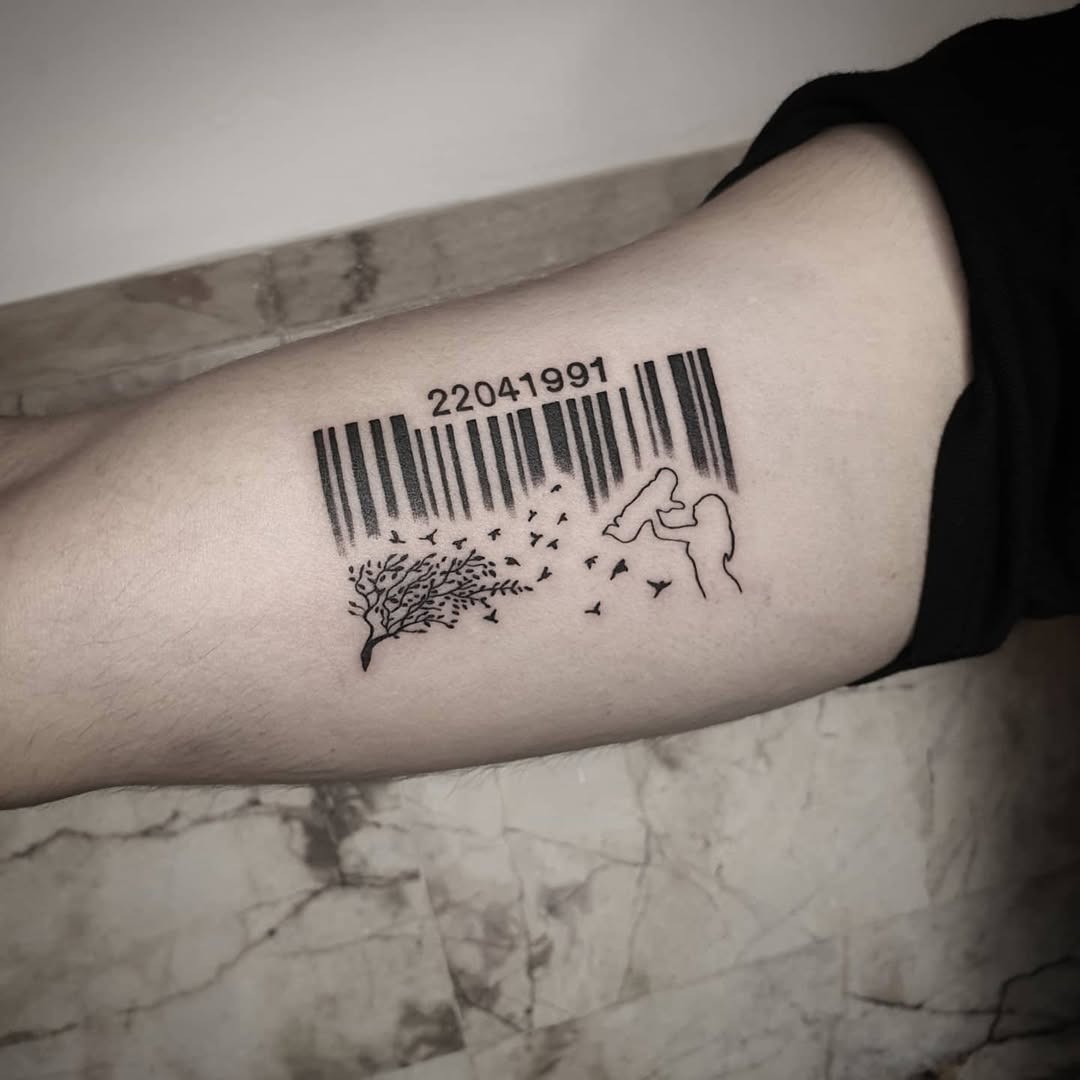 This tattoo showcases a barcode intertwined with a nature theme.