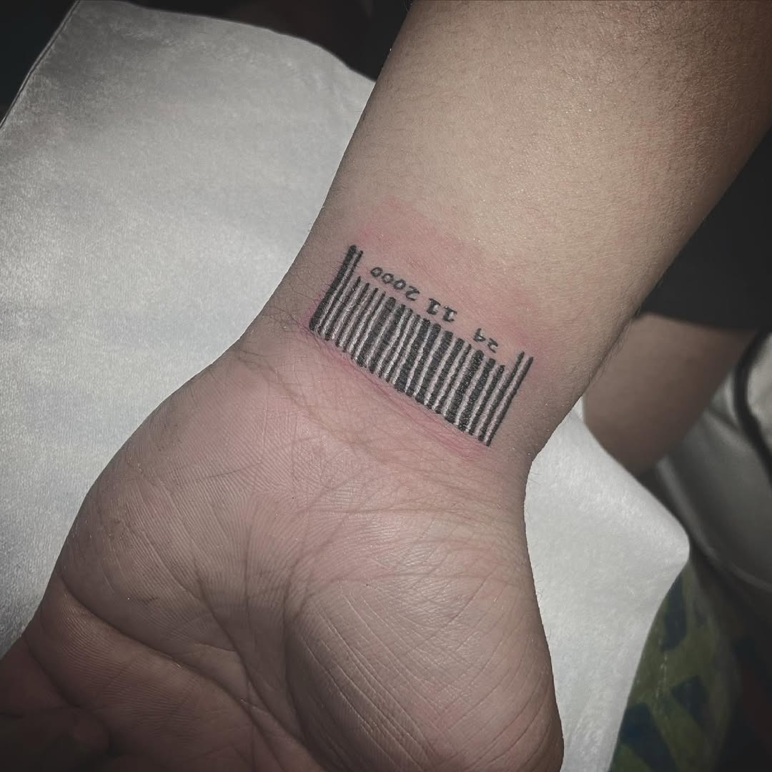 This barcode tattoo features a distinctive design etched on the wrist, blending art and personal expression.