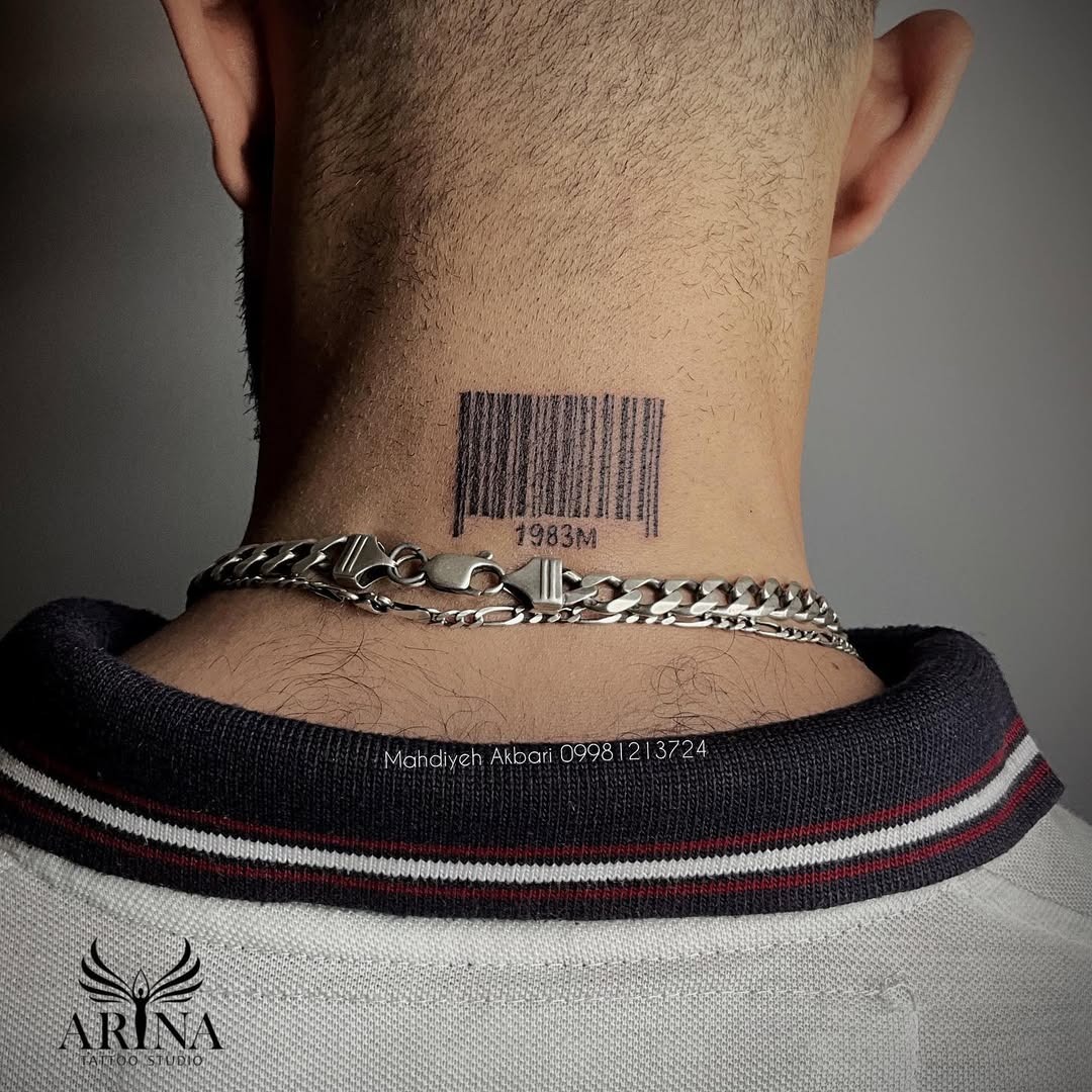 This barcode tattoo sits boldly on the back of the neck, framed by a silver chain, adding an edgy vibe.