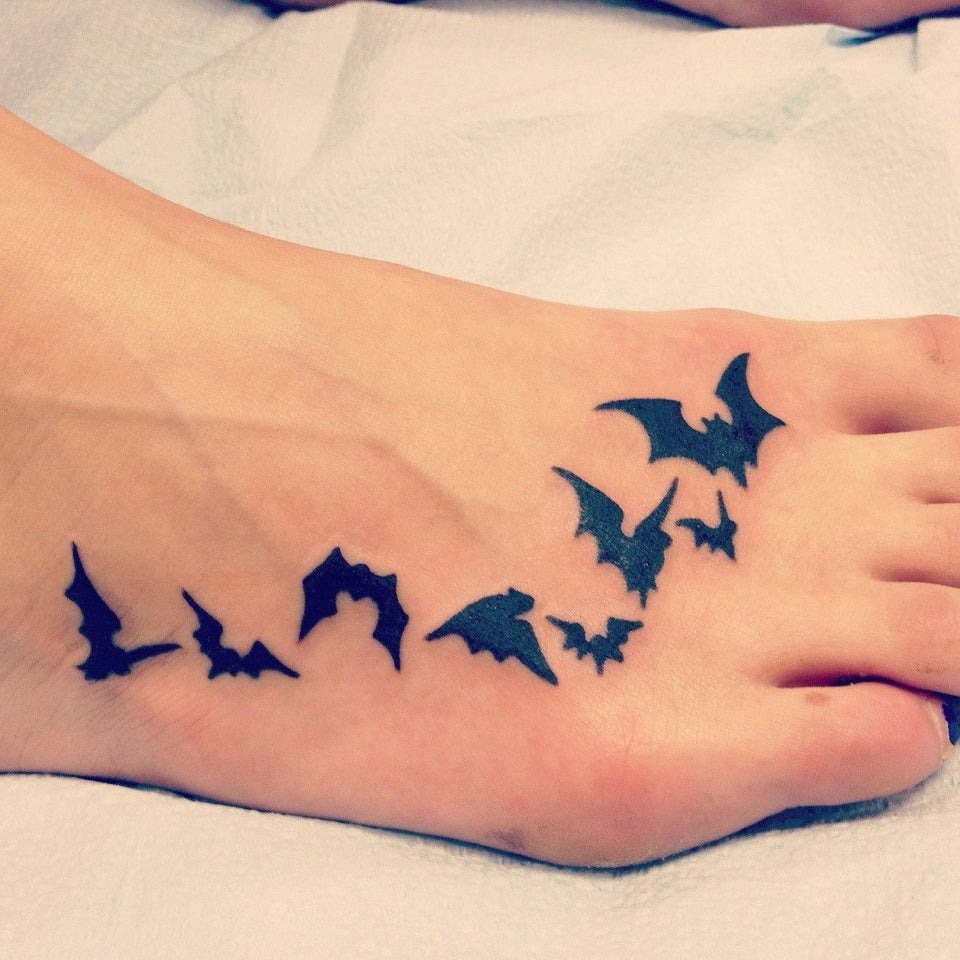 Dainty Flock of Bats onFoot TattooBatman Tattoo Ideas Tattoo Design