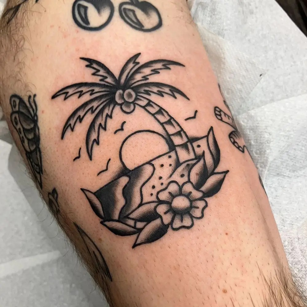 Classic Black-and-White Beach Scene Tattoo Design