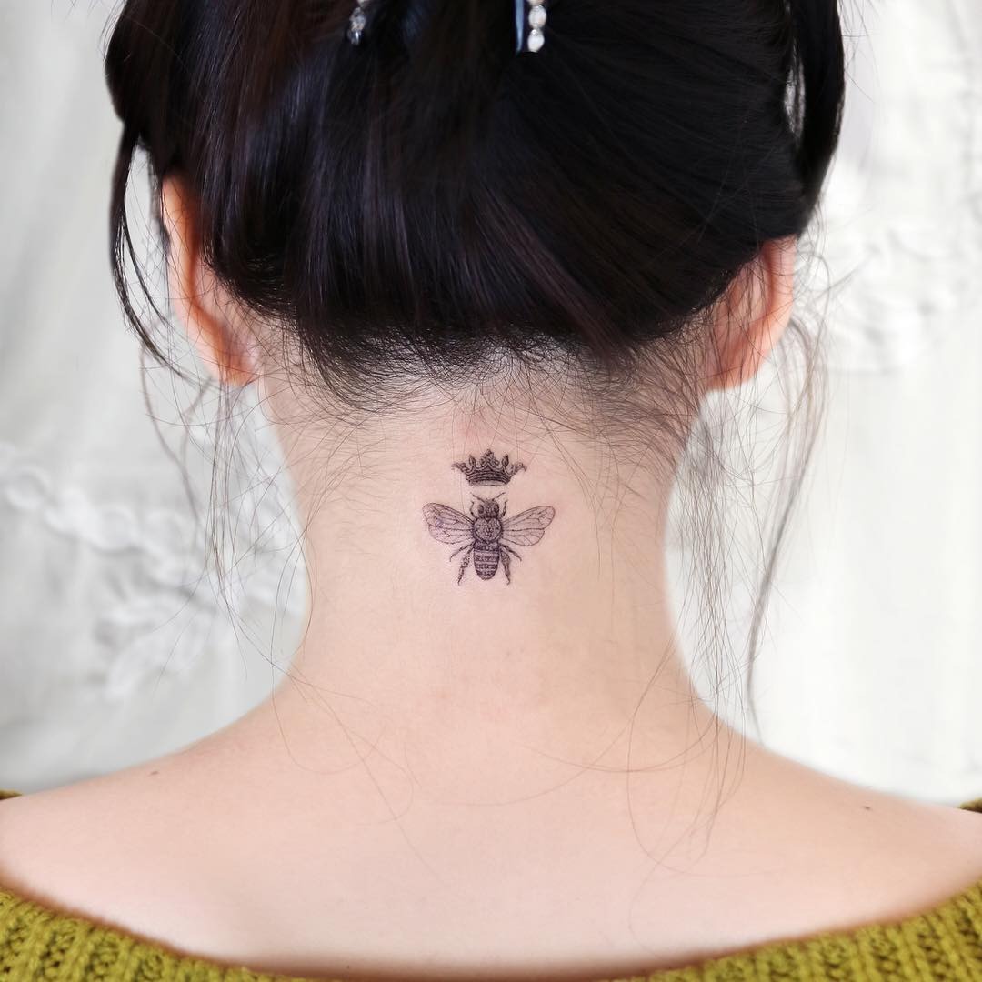 Charming queen bee tattoo design on nape Tattoo Design