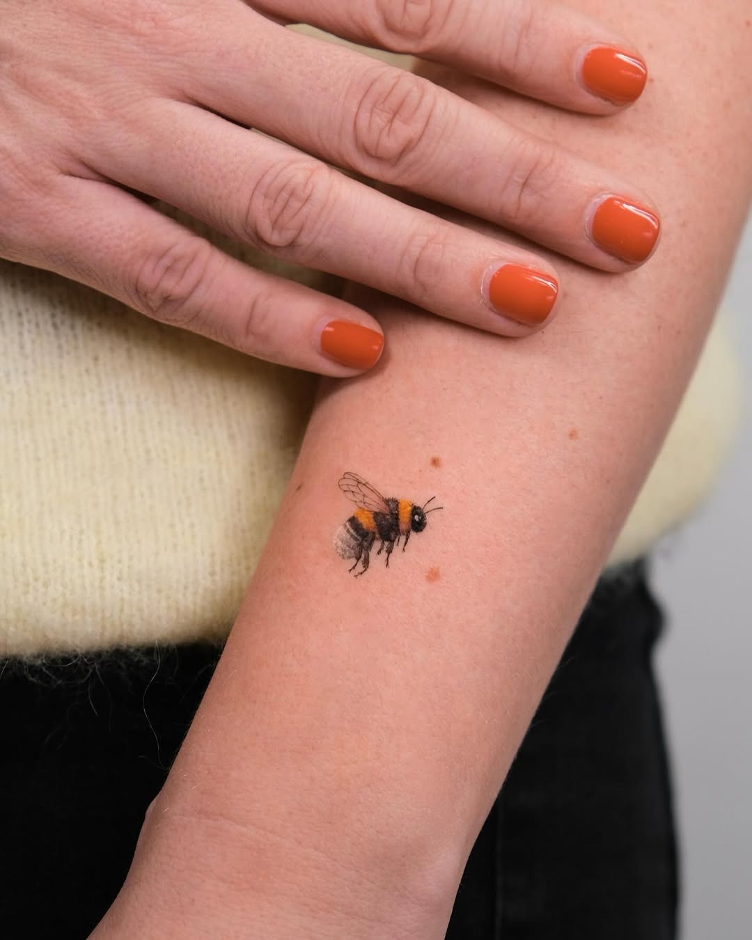 Elegant realistic bumblebee tattoo on arm Tattoo Design
