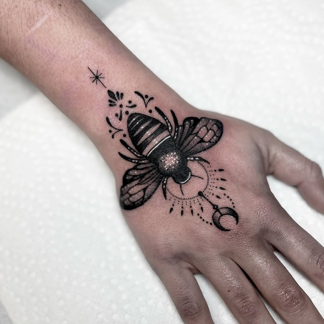 Stunning geometric bumblebee tattoo on hand Tattoo Design