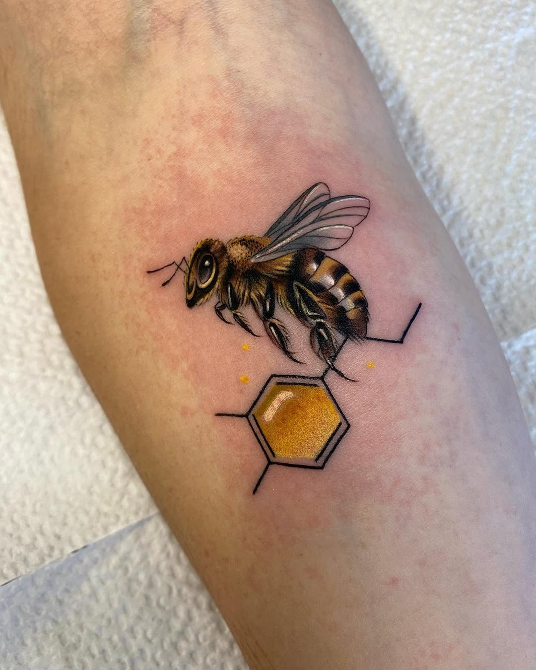 Stunning realistic bee and honeycomb tattoo Tattoo Design