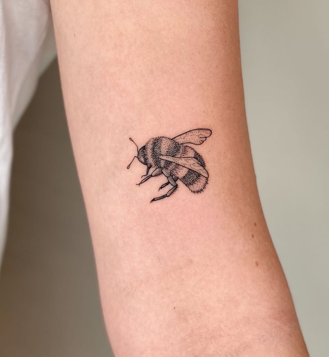 Stunning realistic bee tattoo on the arm Tattoo Design