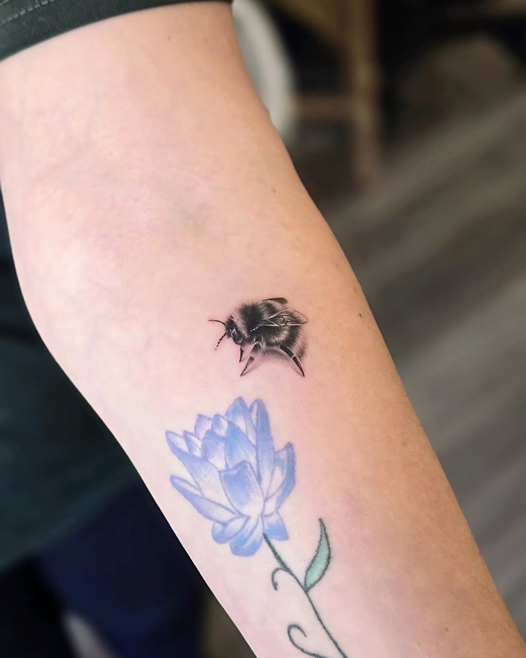 Stunning realistic bee tattoo with floral design Tattoo Design