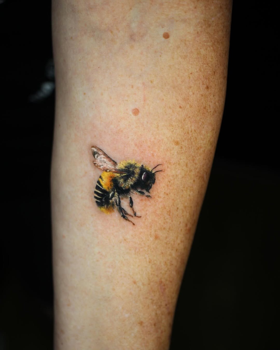 Stunning realistic bumblebee tattoo on arm Tattoo Design
