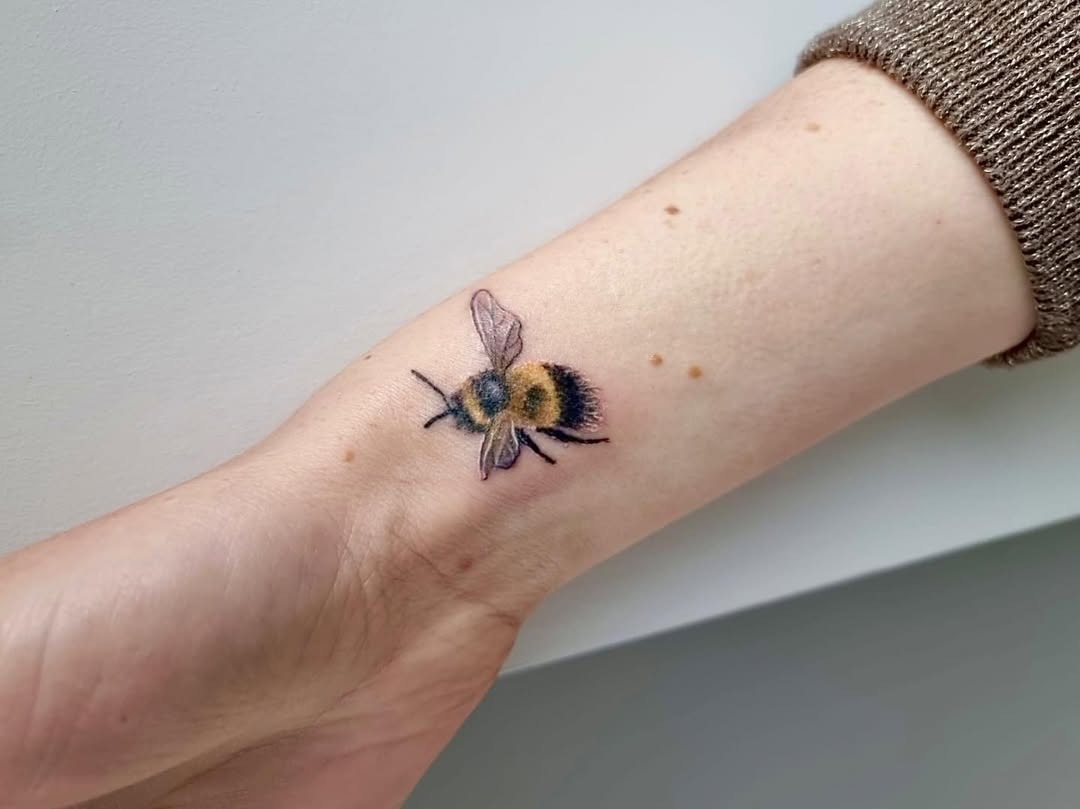 Stunning realistic bumblebee tattoo on wrist Tattoo Design