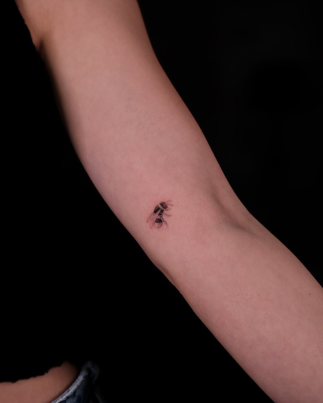 Stylish minimalist bee tattoo on the arm Tattoo Design