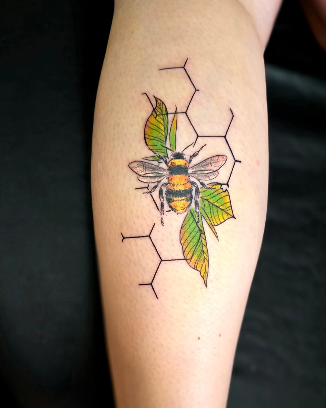 Vibrant bumblebee with honeycomb design Tattoo Design