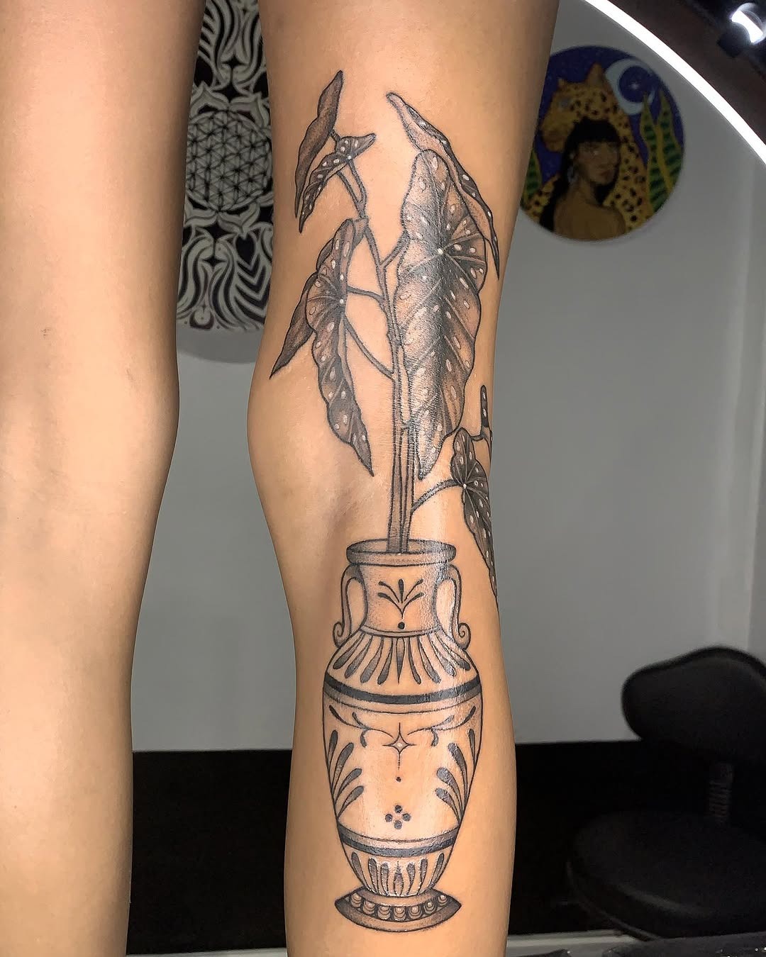 Elegant begonia tattoo in a decorative vase Tattoo Design