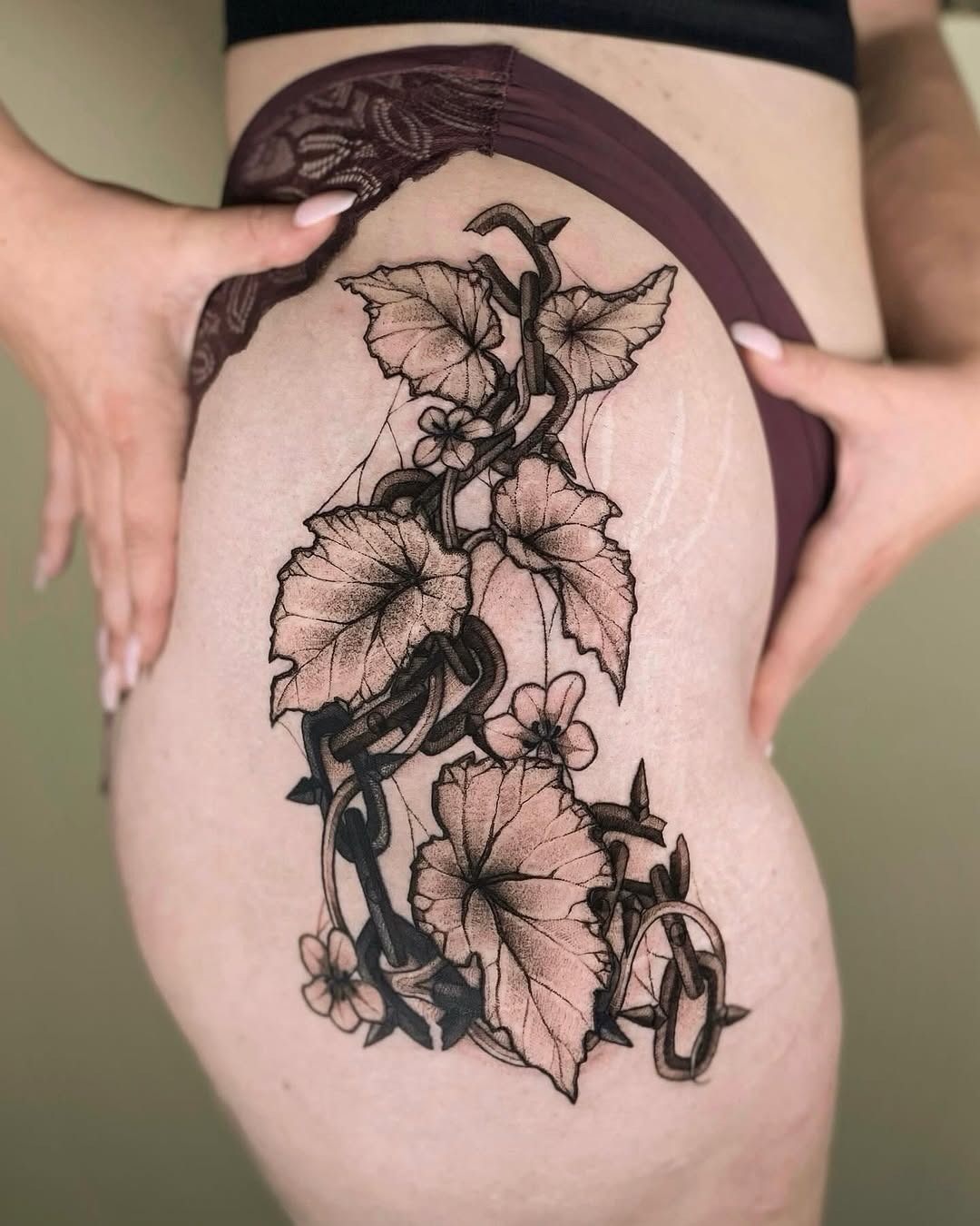 Stunning begonia tattoo wrapped around the thigh Tattoo Design