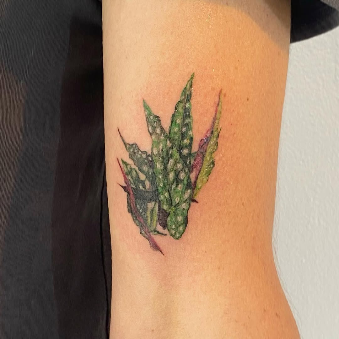 Vibrant Begonia Tattoo with Lush Greenery Tattoo Design