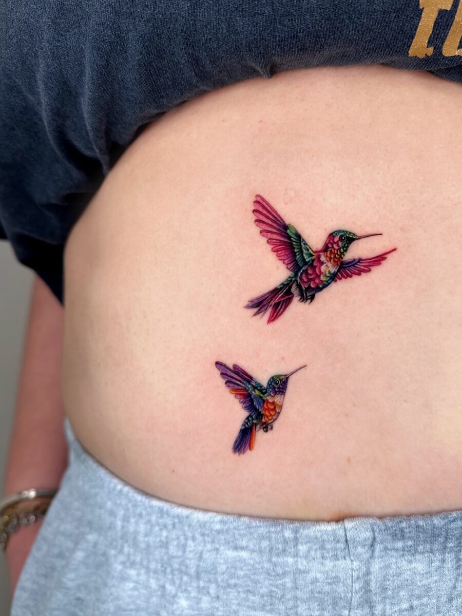 The design centers on colorful hummingbirds gracefully inked imagery that reads clearly at a glance.