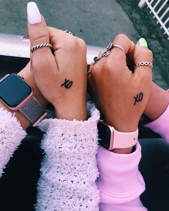 Matching Tattoos Idea: Hugs and Kisses for Affectionate Friends Tattoo Design