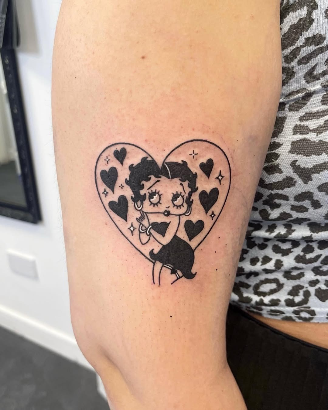 Charming Betty Boop Tattoo with Heart Motif Tattoo Design