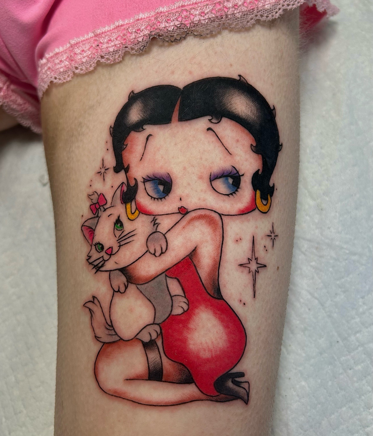 Charming Betty Boop with her adorable cat Tattoo Design
