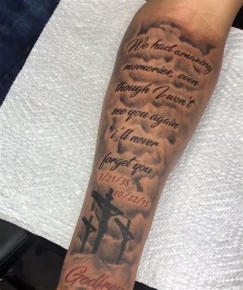 Memorial Cross Forearm Tattoo, a tattoo design rendered in clean detailed linework.