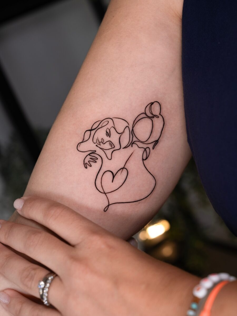 Artistic skeletons in a dynamic tattoo design Tattoo Design