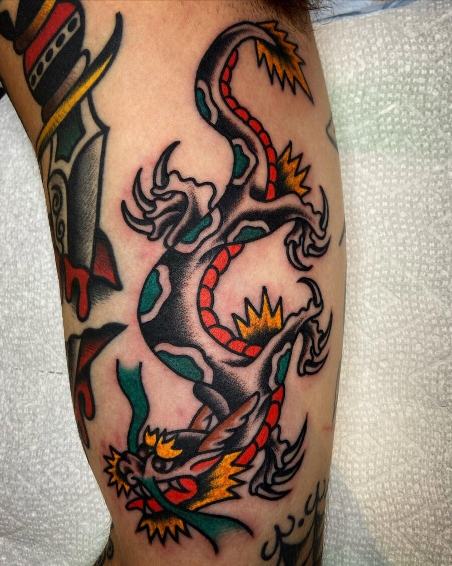 Bold dragon design on bicep tattoo Tattoo Design