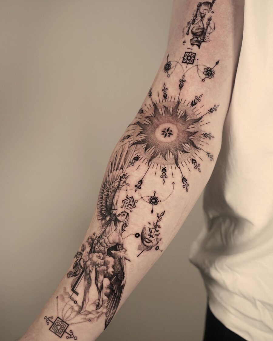 Eye-catching biceps tattoo with sun and phoenix Tattoo Design