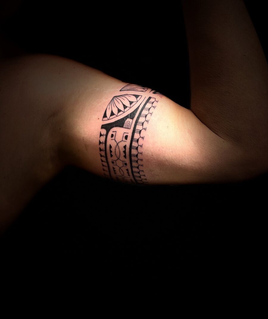 Intricate tribal design adorns bicep Tattoo Design