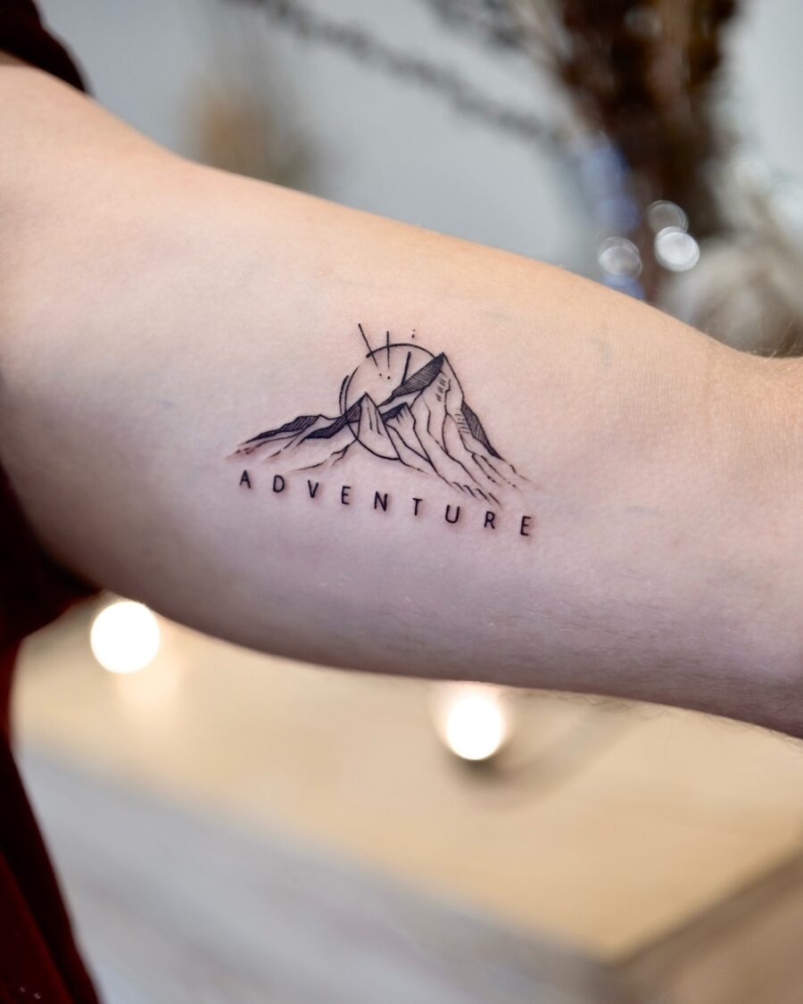 Nature-inspired wolf tattoo on bicep Tattoo Design