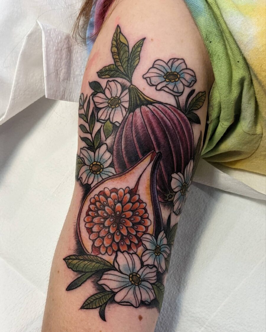 Stunning floral design wrapped around the bicep. Tattoo Design