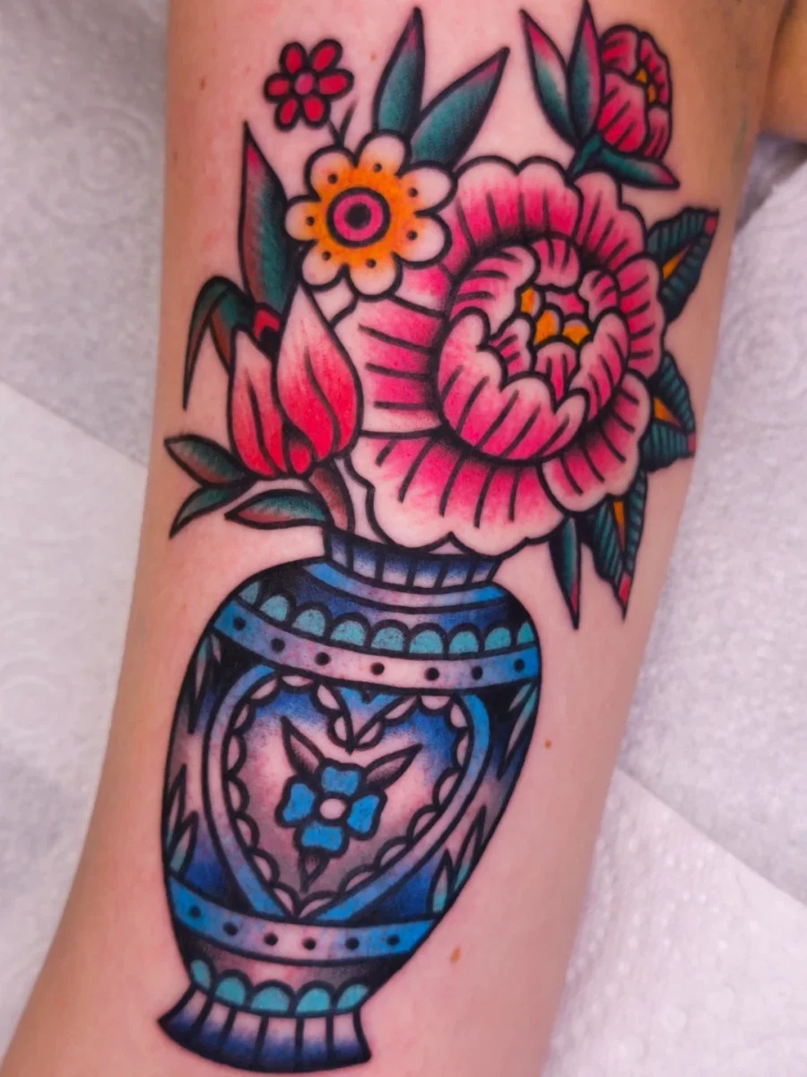 Stylish fish tattoo enhancing arm aesthetics Tattoo Design