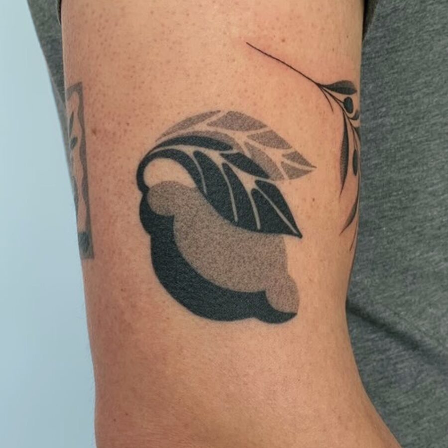 Stylish leaves tattoo on bicep Tattoo Design