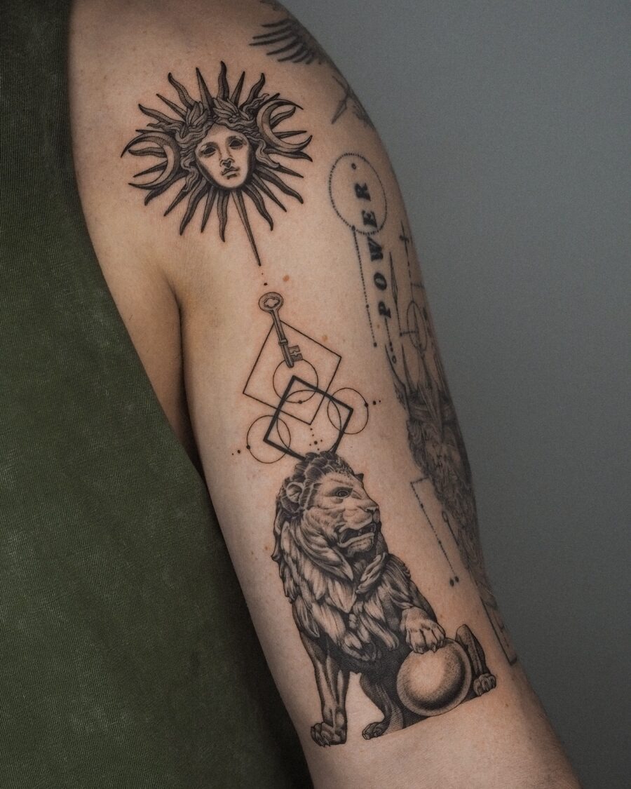 Symbolic biceps tattoo of sun and lion Tattoo Design