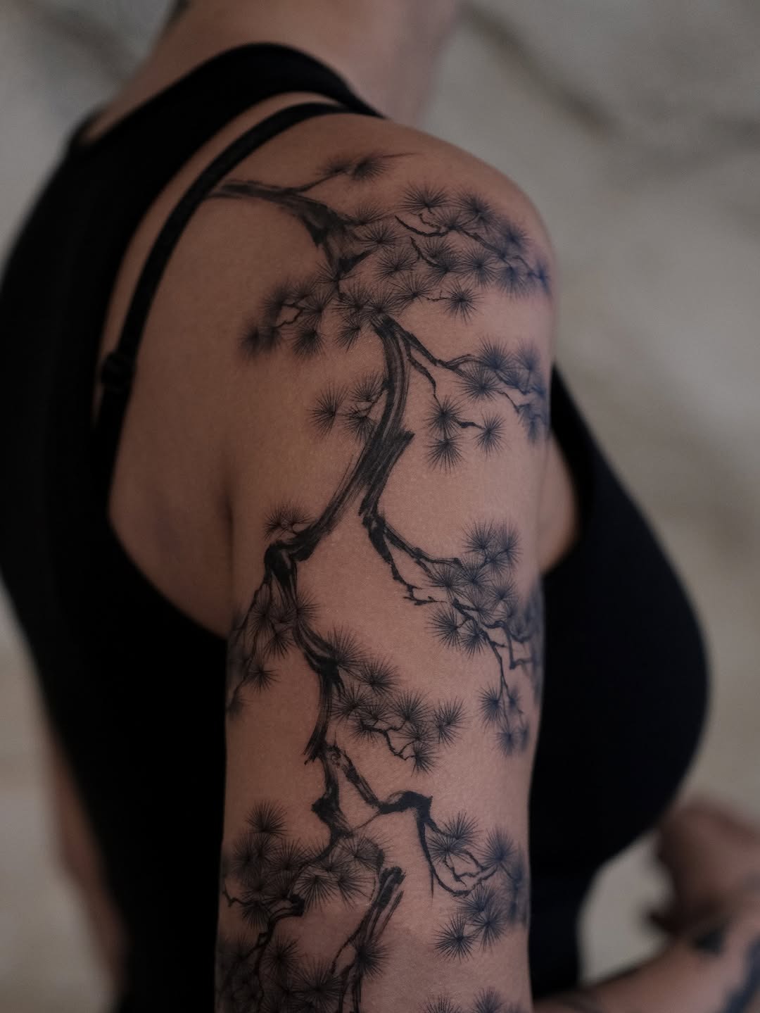 This impressive birch tree tattoo wraps elegantly around the arm.
