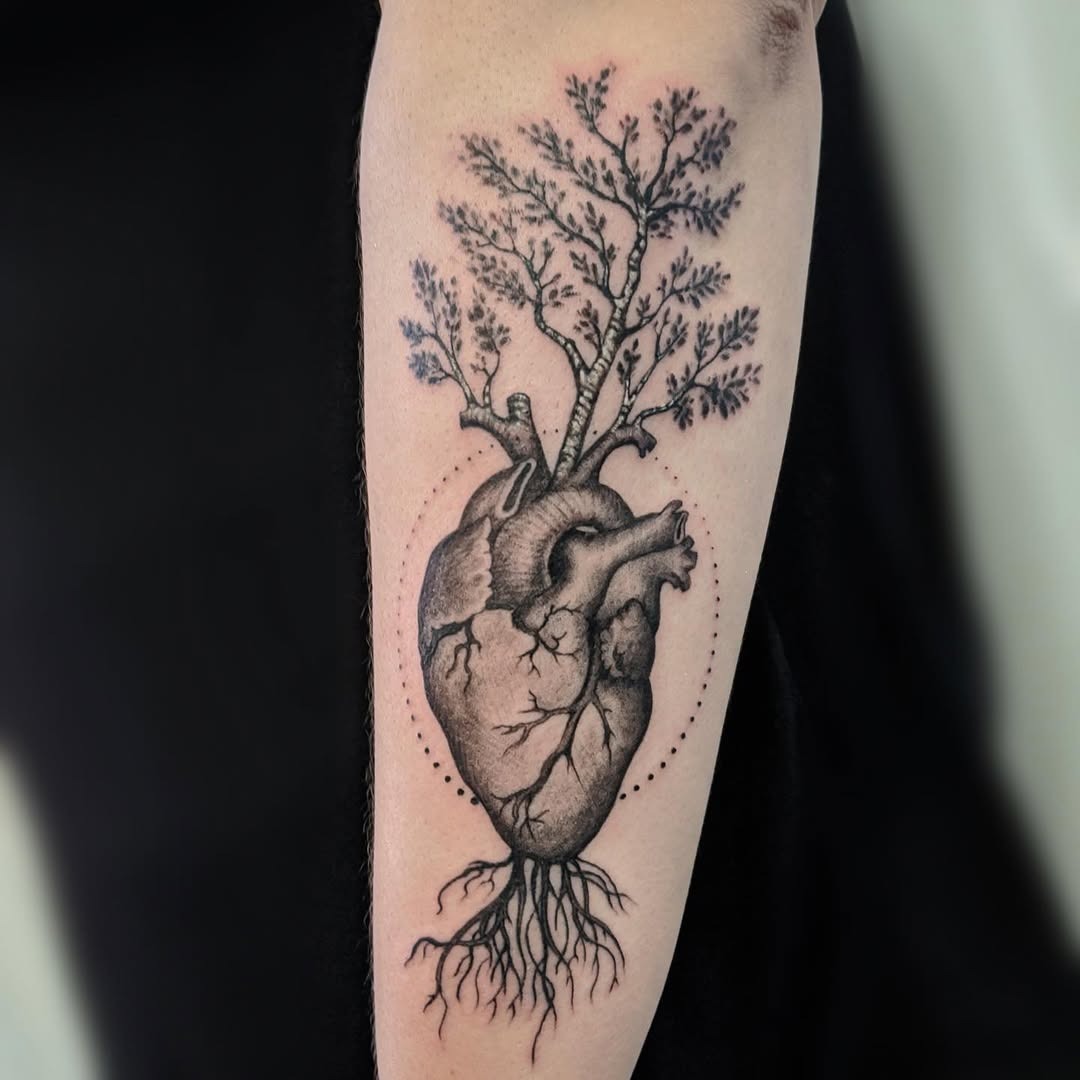 This stunning tattoo merges a heart with a birch tree, symbolizing life and emotion.