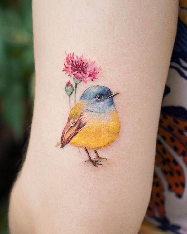 Bright Yellow Bird with Pink Flower Tattoo Design