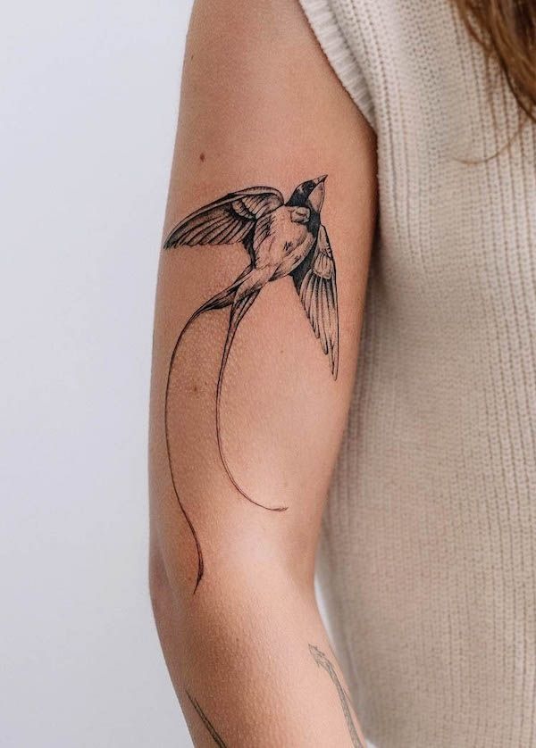 Elegant Swallow in Flight Tattoo Design