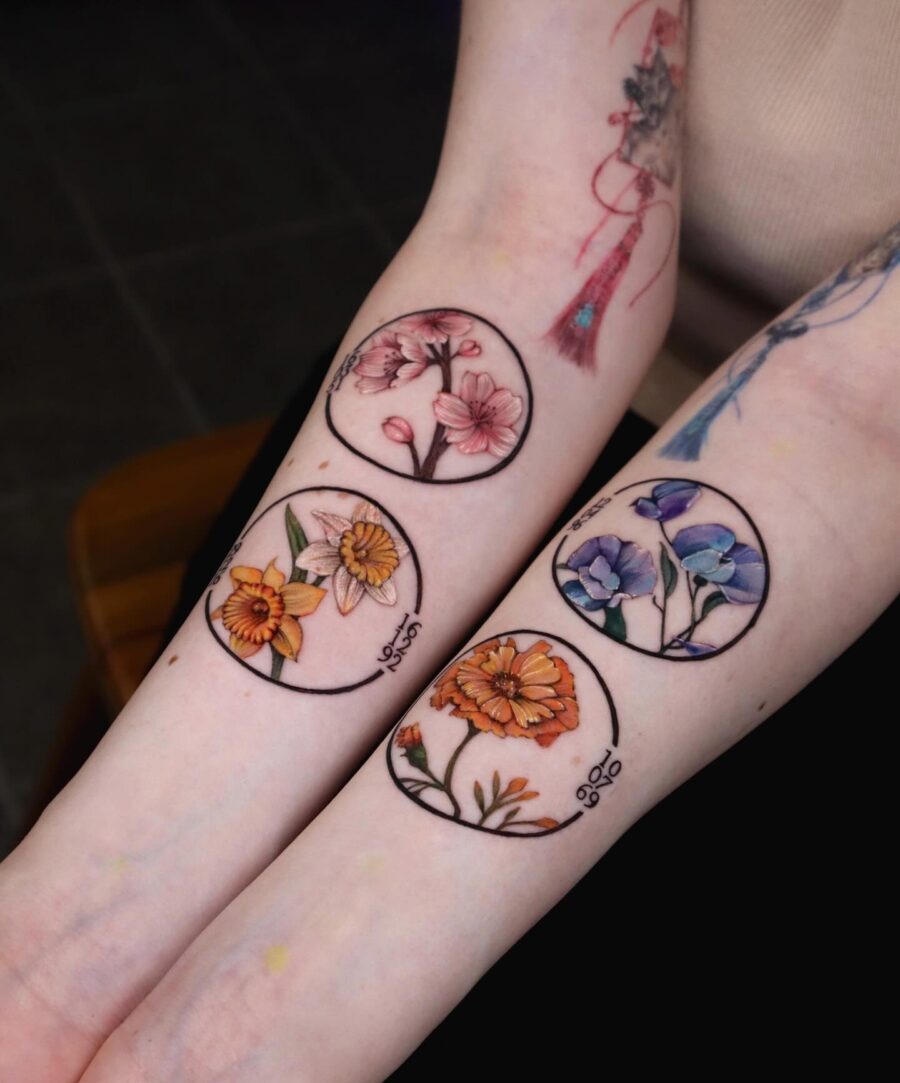 These beautiful birth flower tattoos showcase delicate floral designs, each representing a different month.