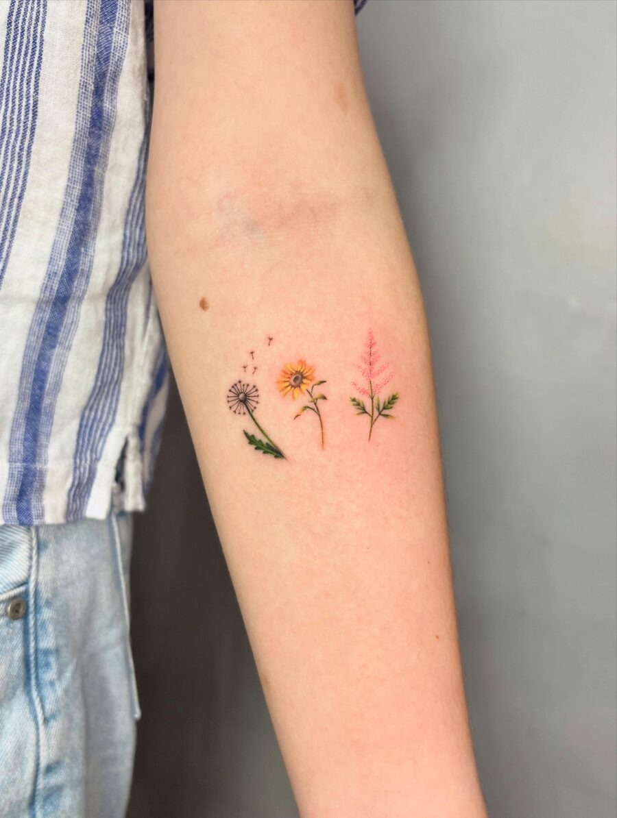 This image showcases a charming collection of birth flower tattoos.